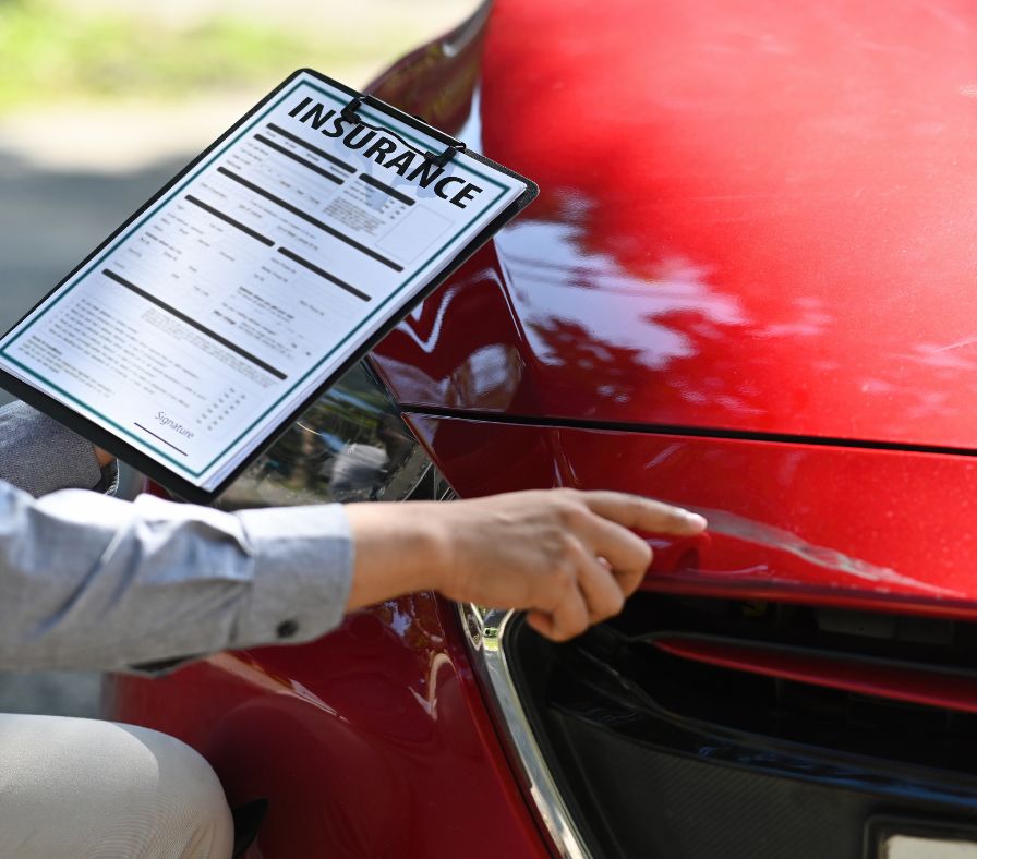 Traveler checking rental car for damage