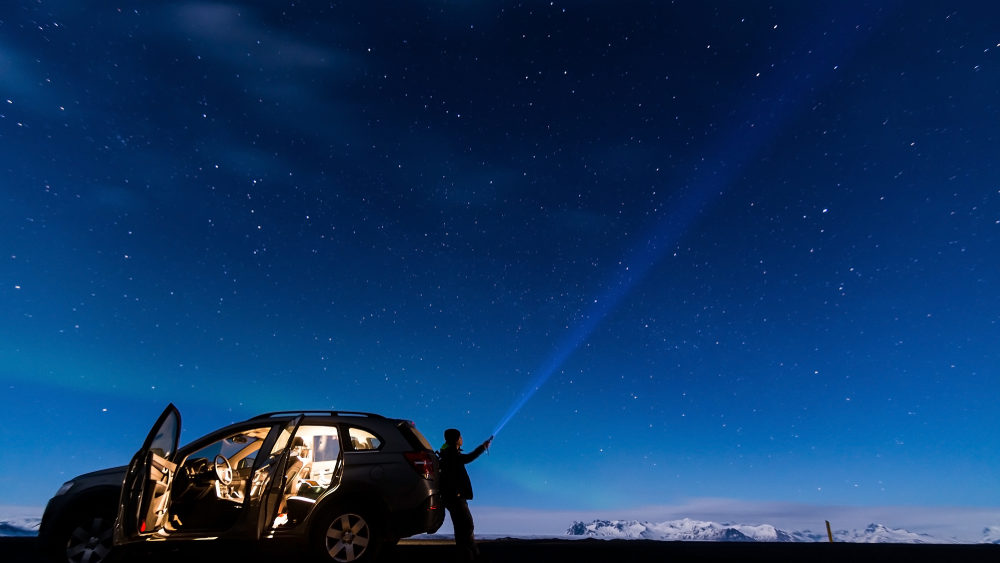 Rental car under a mesmerizing starry night | Rental Car Stargazing Destinations
