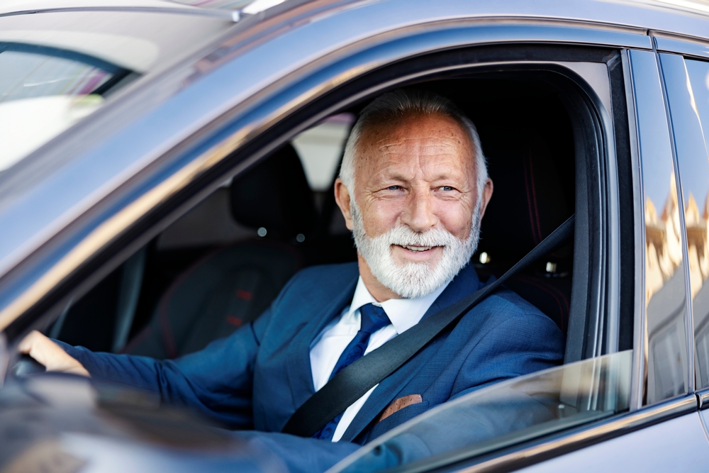 Entrepreneur driving a rental car