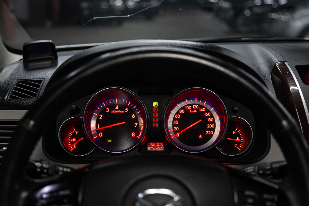 Close-up of Car Odometer and Fuel Gauge.